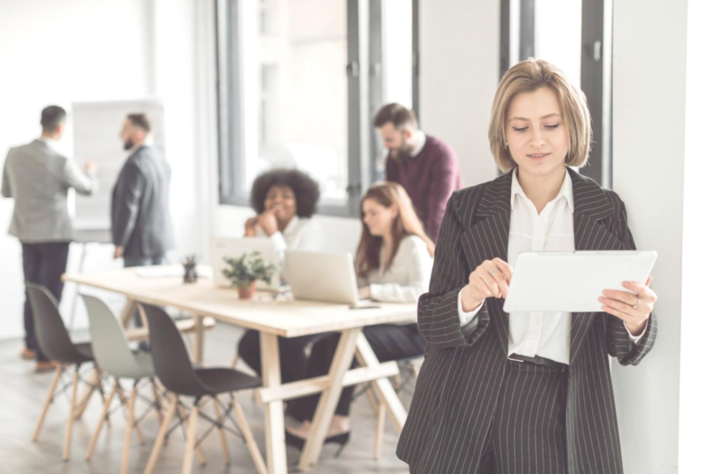Person reviewing financial charts and budget documents at desk